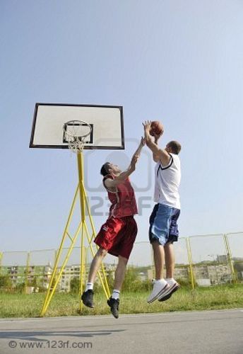 8310909-streetball-basketball-game-with-two-young-player-at-early-morning-on-city-court.jpg
